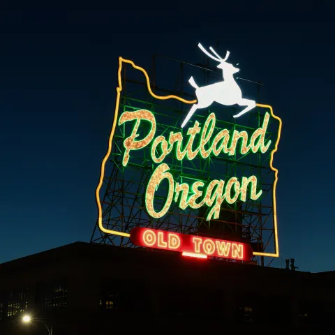 portland oregon old town neon sign with white stag in twilight sky